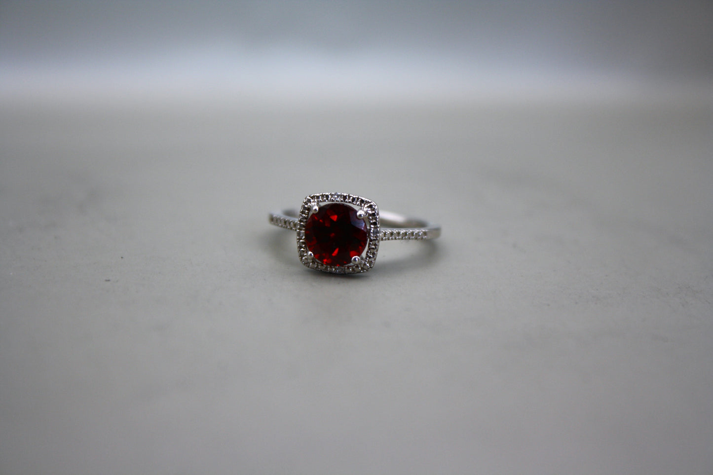 Sterling Silver Cushion Cut Garnet Ring with Diamond Accents