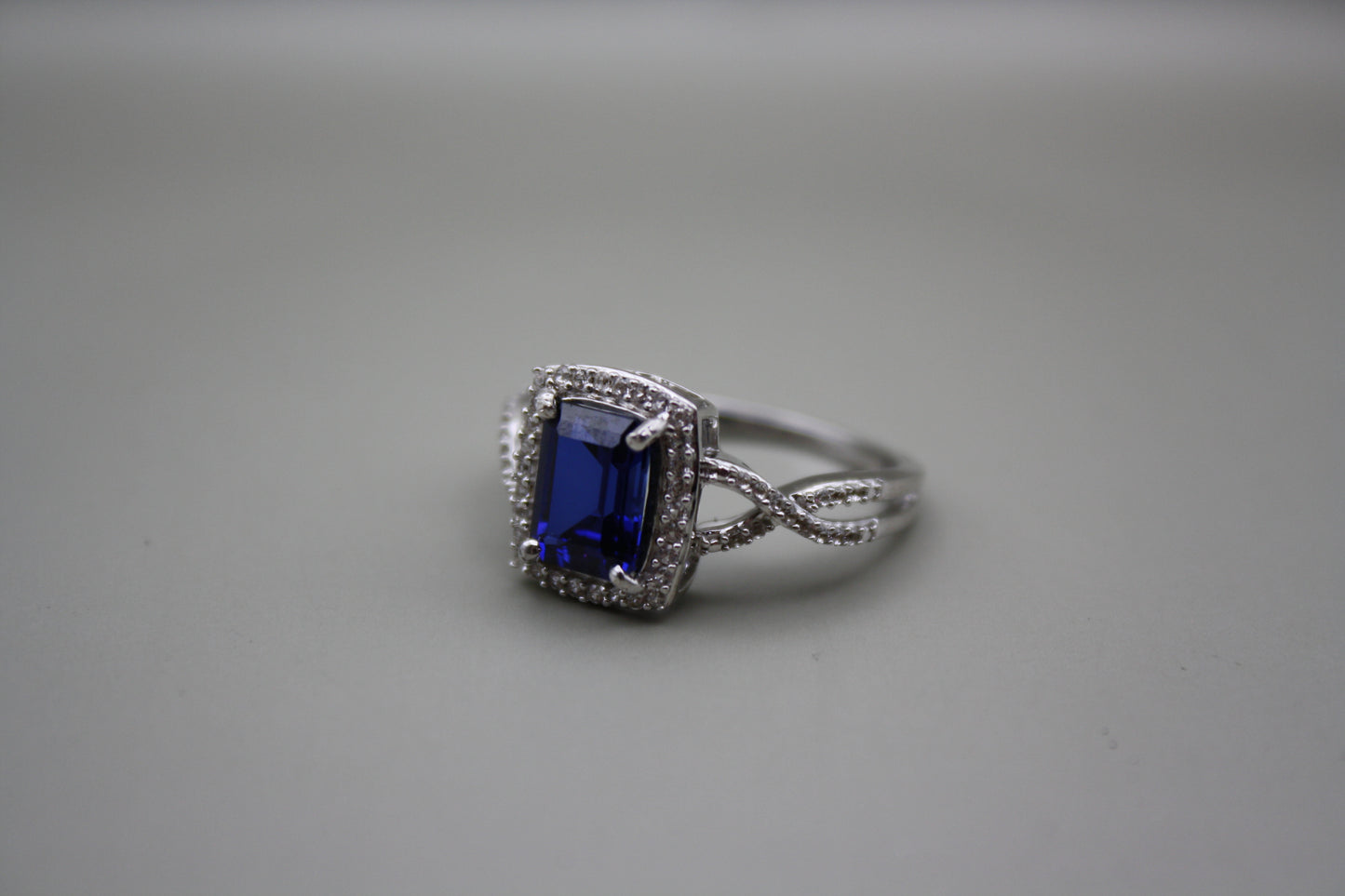 Emerald Cut Lab Sapphire Halo Ring in Sterling Silver