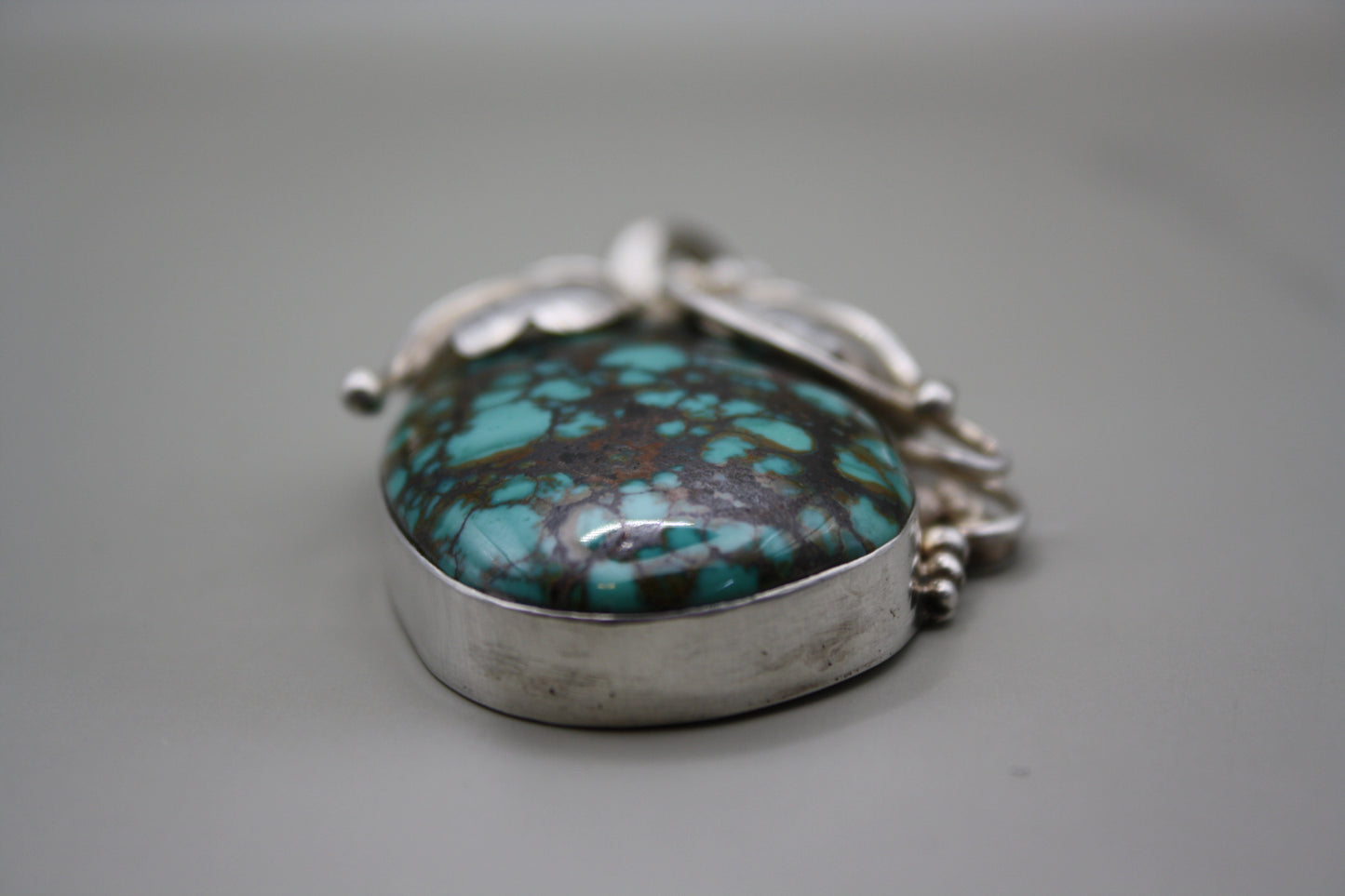 Sterling Silver Turquoise Cabochon Pendant: Nature-Inspired Foliage Wrap