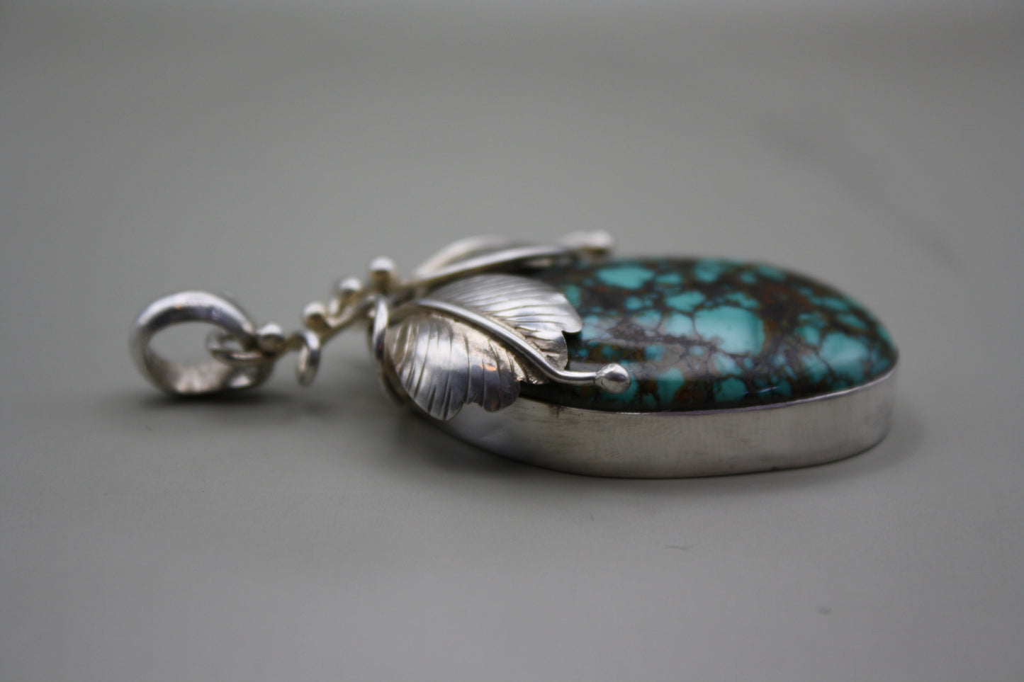 Sterling Silver Turquoise Cabochon Pendant: Nature-Inspired Foliage Wrap