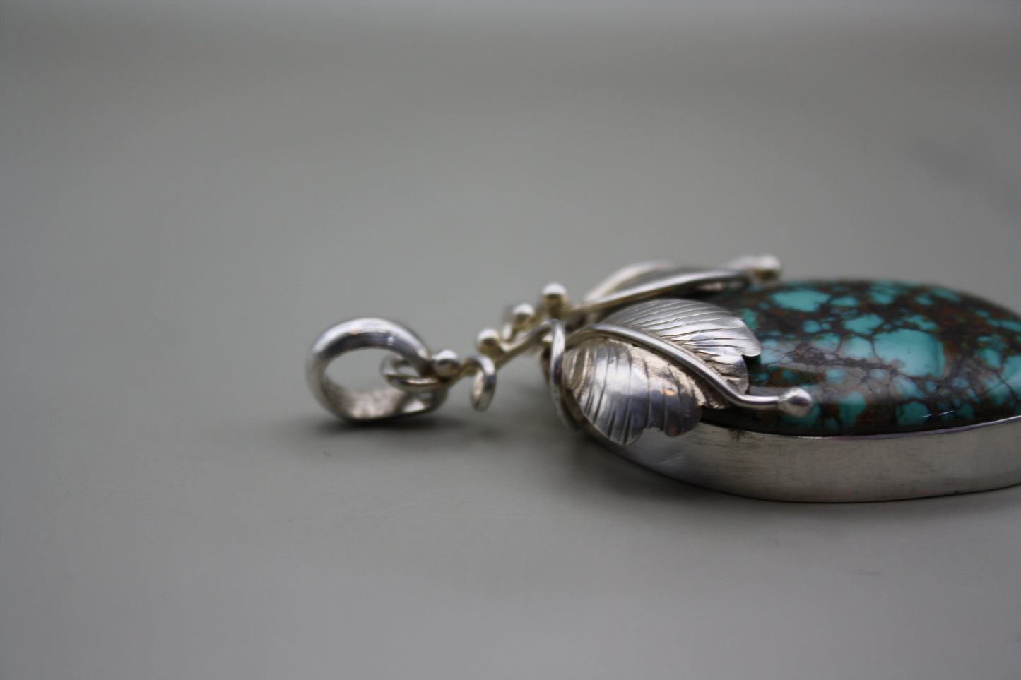 Sterling Silver Turquoise Cabochon Pendant: Nature-Inspired Foliage Wrap