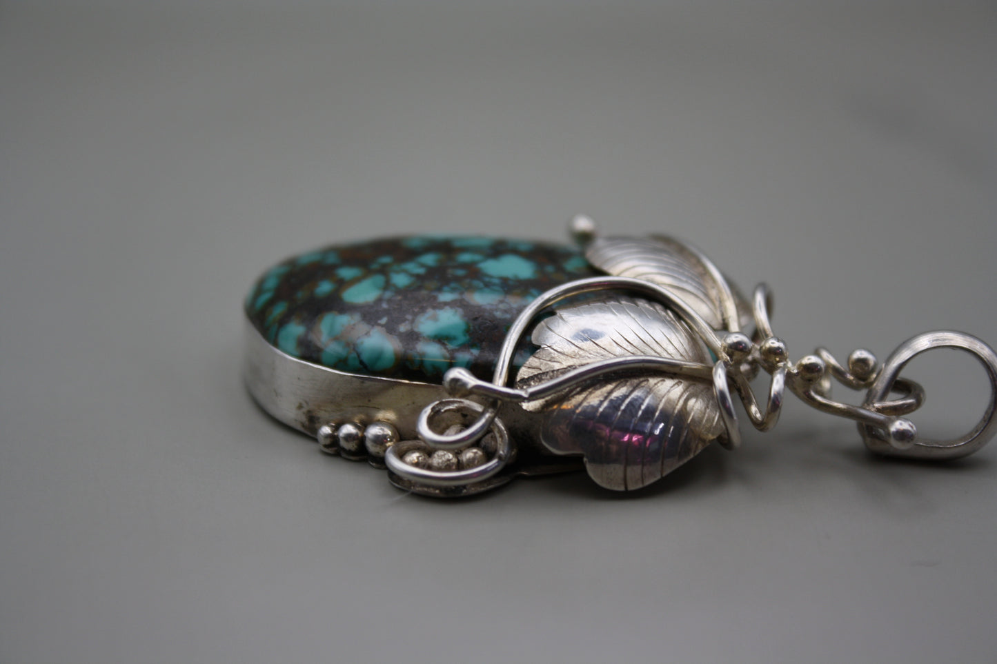 Sterling Silver Turquoise Cabochon Pendant: Nature-Inspired Foliage Wrap