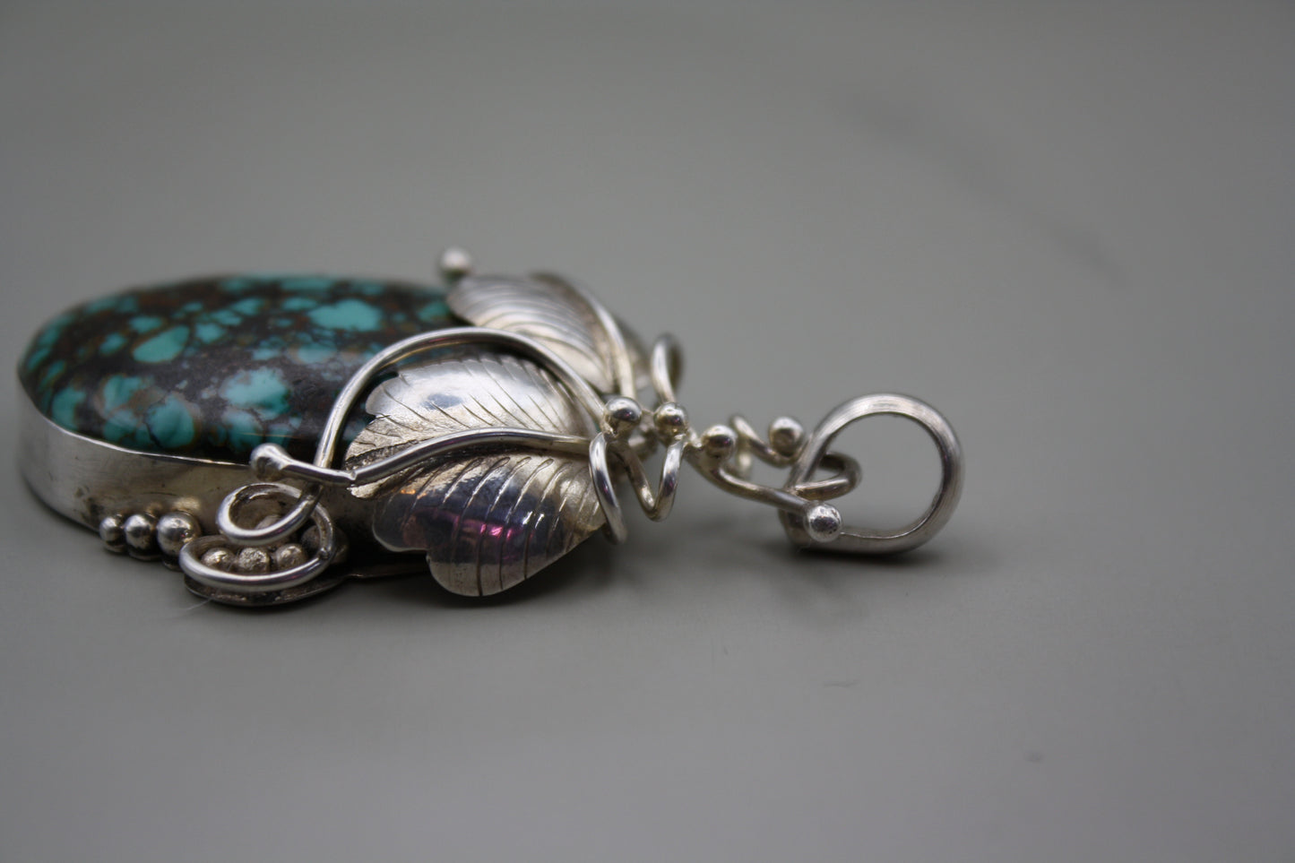 Sterling Silver Turquoise Cabochon Pendant: Nature-Inspired Foliage Wrap