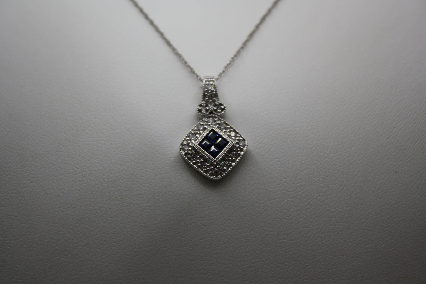 Blue Sapphire and Diamond Halo Necklace in 14K White Gold