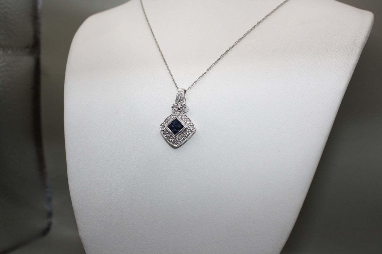 Blue Sapphire and Diamond Halo Necklace in 14K White Gold