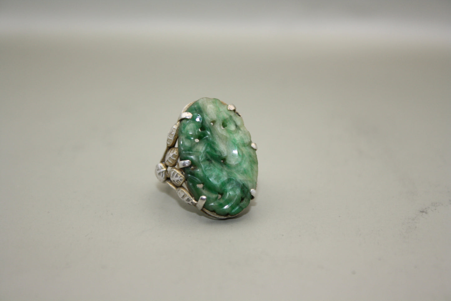 Antique Carved Jadeite Sterling Silver Ring with Intricate Leaf and Vine Motif